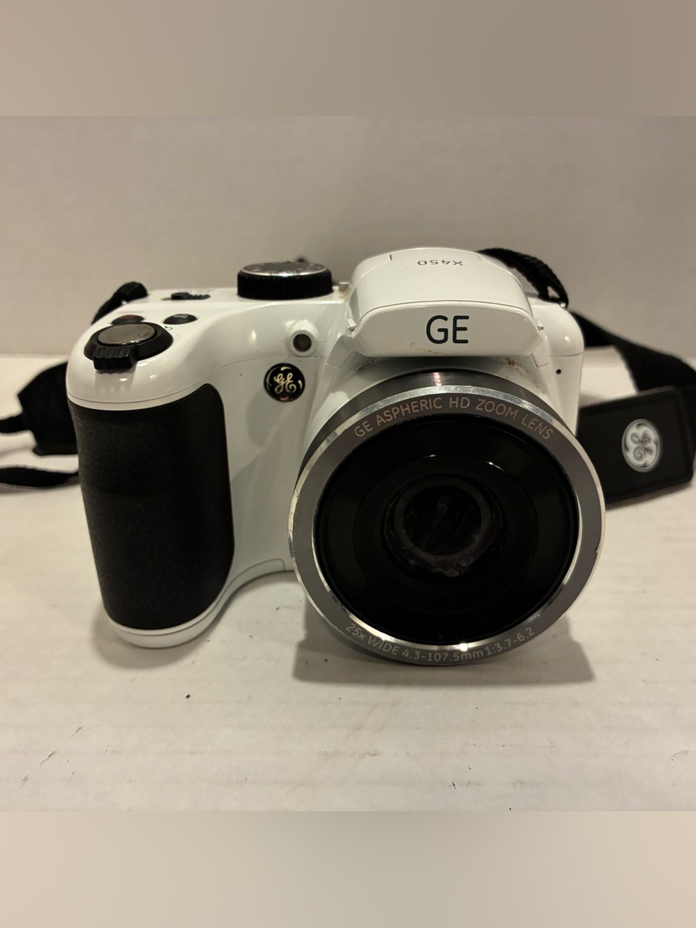 GE Digital Camera x450.  It is white and take very good pictures.
